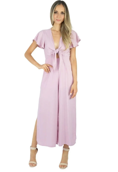 Macacão Liage Liso Pantacourt Manga Curta Decote Laço Fenda Lateral Transparencia Babado Chiffon Rosa Claro